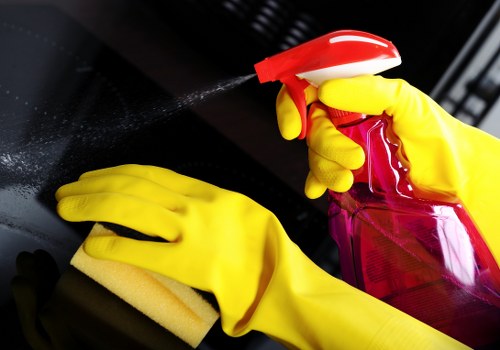 Professional cleaner preparing a bedroom for Airbnb guest turnover