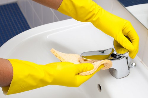 Window cleaning tools including squeegee and microfiber cloth on a work surface